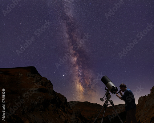 Man using a telescope and observing stars and the milky way