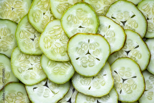 Sliced cucumber background. Cucumber is a nutritious fruit with a high water content. photo
