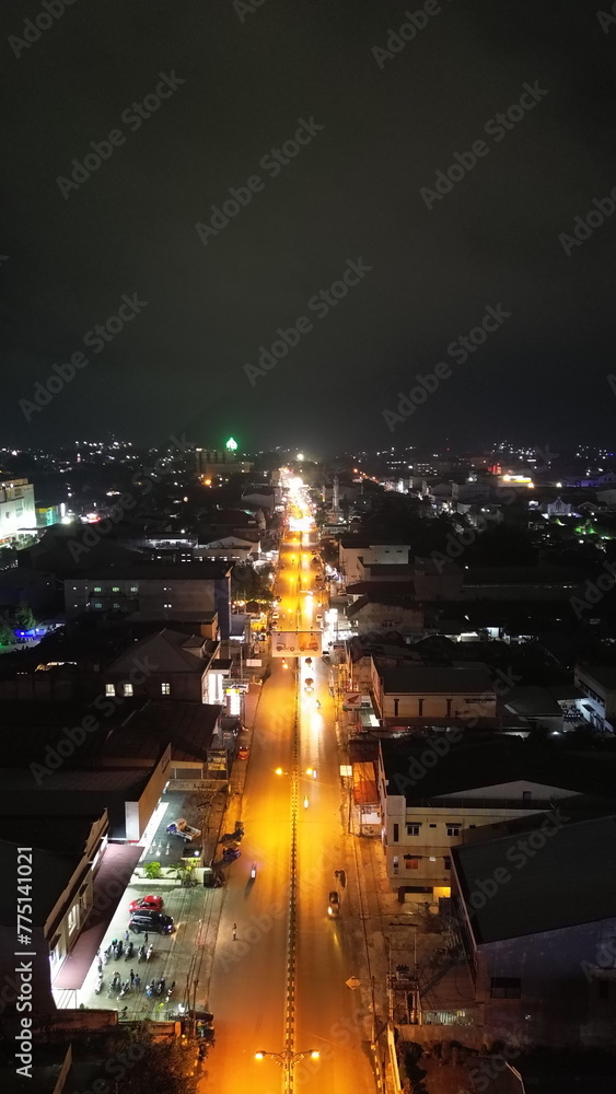 Aerial view of night road traffic in downtown Gorontalo, Indonesia