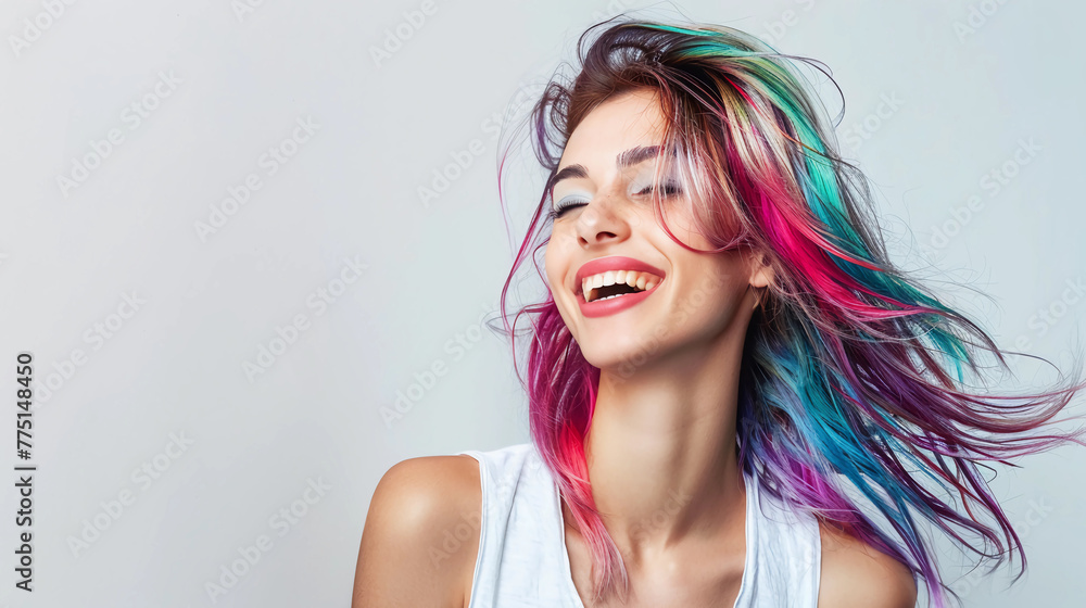 Pretty youthful woman with brightly-colored hair wearing a white leather jacket.