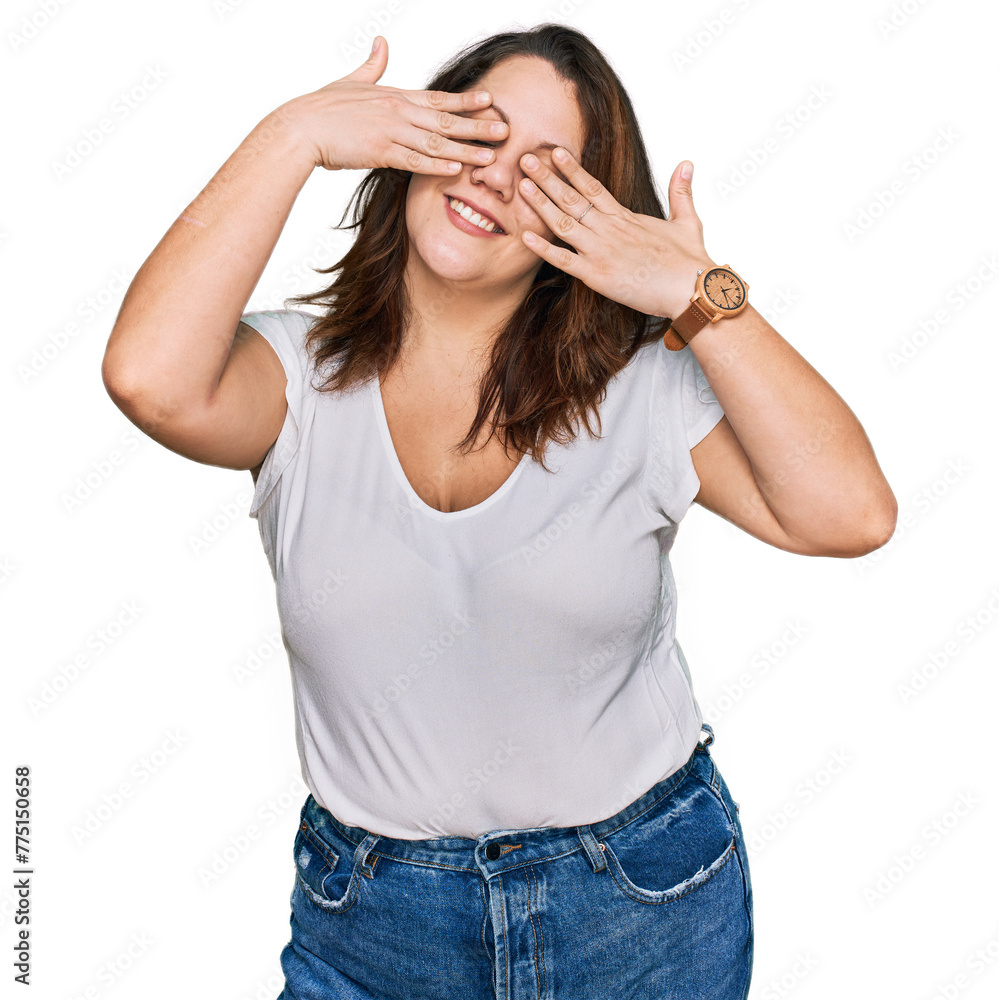 Young plus size woman wearing casual white t shirt covering eyes with hands smiling cheerful and funny. blind concept. Young plus size woman wearing casual white t shirt covering eyes with hands smiling cheerful and funny. blind concept.
