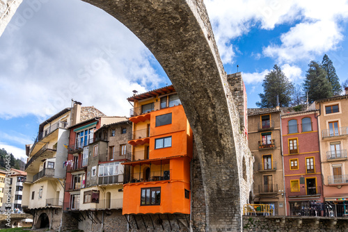 Girona, Spain - March 29, 2024. The river Ter passes through the medieval village of Camprodon with its ancient stone bridge. Girona, Spain photo