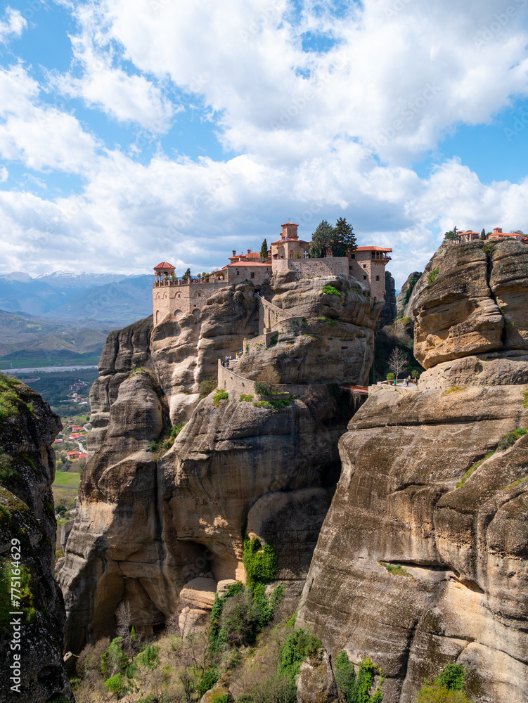 Meteora Monasteries and the surrounding rock formation on a partly cloudy day 12