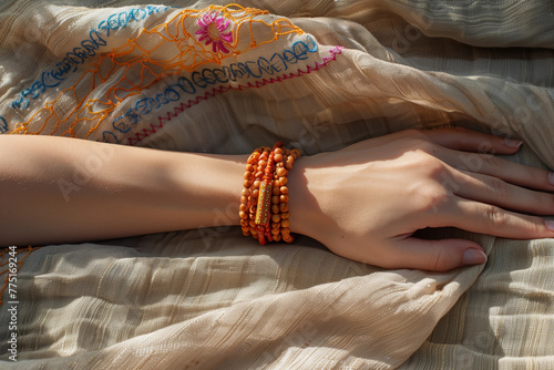 Spiritual bracelets on female hand, natural colors and textures