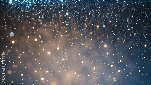 Looping 4K Video of Shimmering Blue Glitter Cascading in Light Beams photo