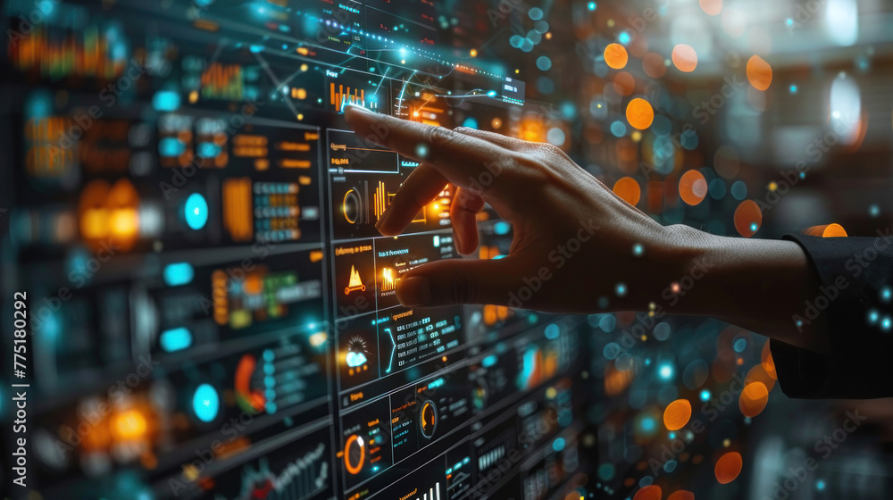 The image illustrates a human hand engaging with a sophisticated, futuristic dashboard featuring high-tech data graphics The image illustrates a human hand engaging with a sophisticated, futuristic dashboard featuring high-tech data graphics