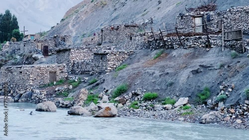 Old villages in Tajikistan. Tajikistan's road along the Zeravshan River near the Pamir highway. Old stone villages in the mountains of the Silk Road. 4К photo