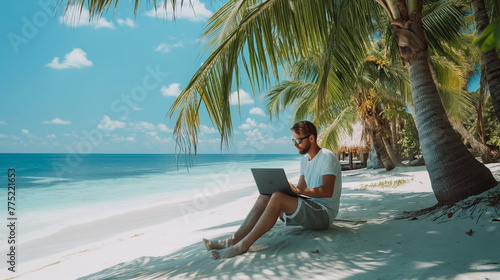 Digital Nomad Lifestyle, Freelancer Working Remotely on Laptop From Tropical Beach Paradise © Mars0hod