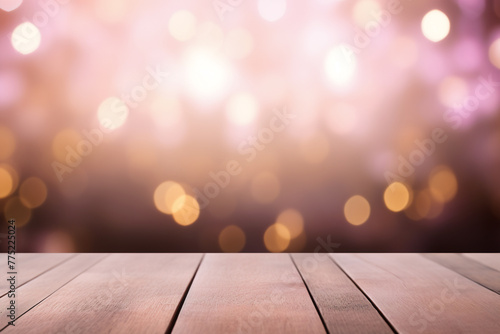 Empty wooden planks or tabletop in front of a blurred bokeh pink background and minimalist background a product display background or wallpaper concept with front-lighting 