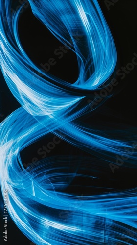 Abstract blue light trails on black background © LabirintStudio