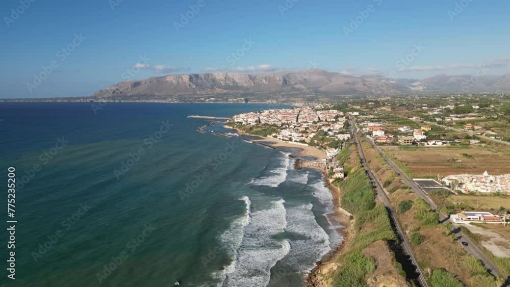 Aerial shot of the sea in Balestrate, Sicily, with waves crashing on the rocky coastline. Aerial shot of the sea in Balestrate, Sicily, with waves crashing on the rocky coastline.