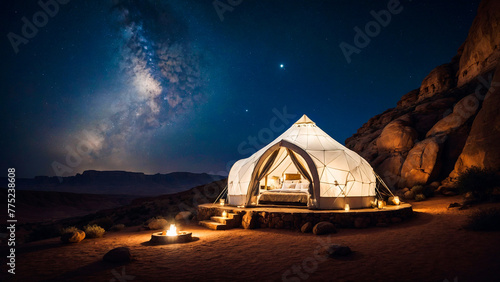 Luxury igloo tent, glamping in the desert at night against of the night starry sky. Luxurious hotel