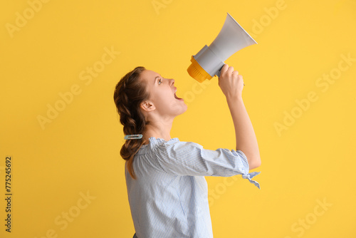 Young woman shouting into m...