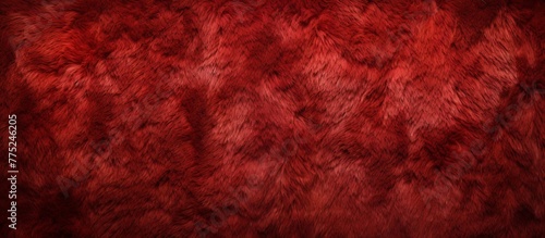 Red fur texture background filled with an abundant amount of fluffy fur, creating a luxurious and cozy feel