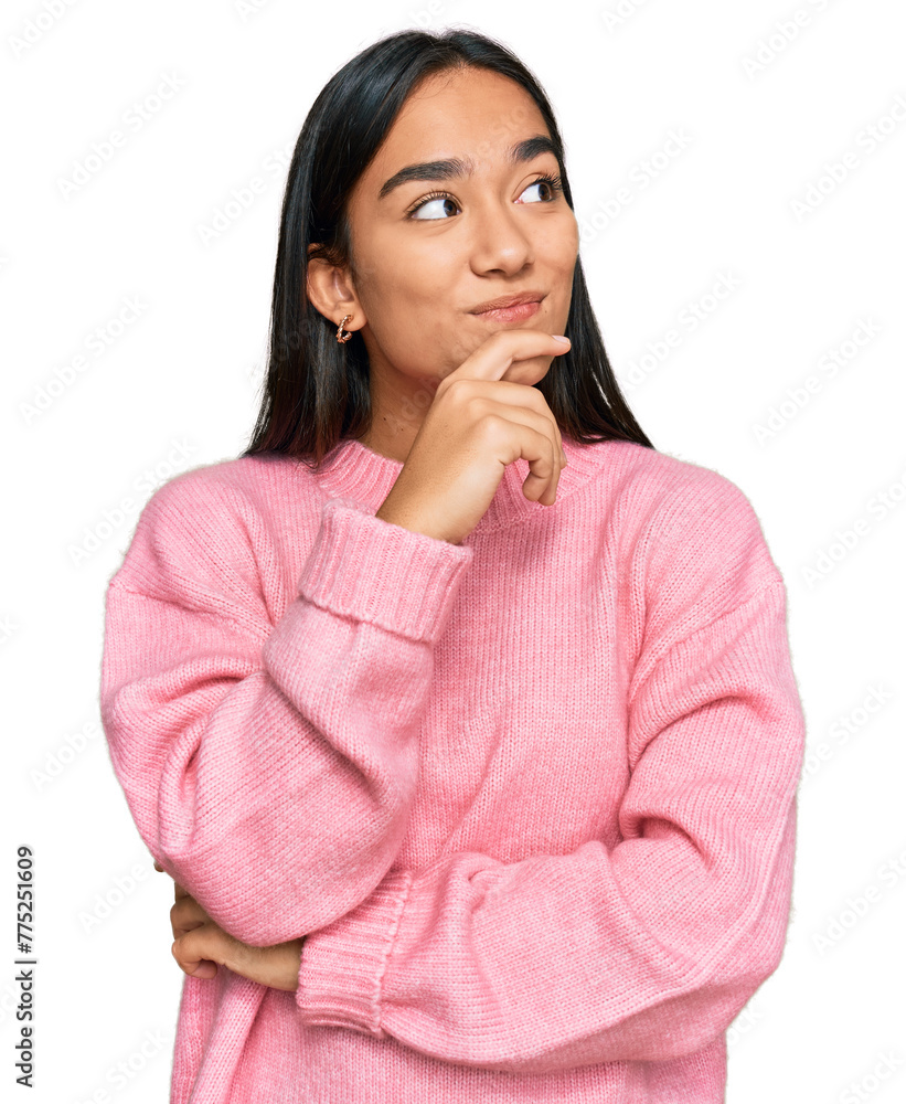 Young asian woman wearing casual winter sweater with hand on chin thinking about question, pensive expression. smiling with thoughtful face. doubt concept. Young asian woman wearing casual winter sweater with hand on chin thinking about question, pensive expression. smiling with thoughtful face. doubt concept.