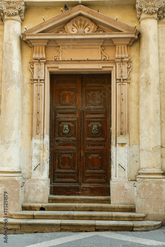 Old wooden door with decora...