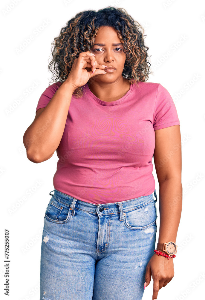 Young african american plus size woman wearing casual clothes mouth and lips shut as zip with fingers. secret and silent, taboo talking Young african american plus size woman wearing casual clothes mouth and lips shut as zip with fingers. secret and silent, taboo talking