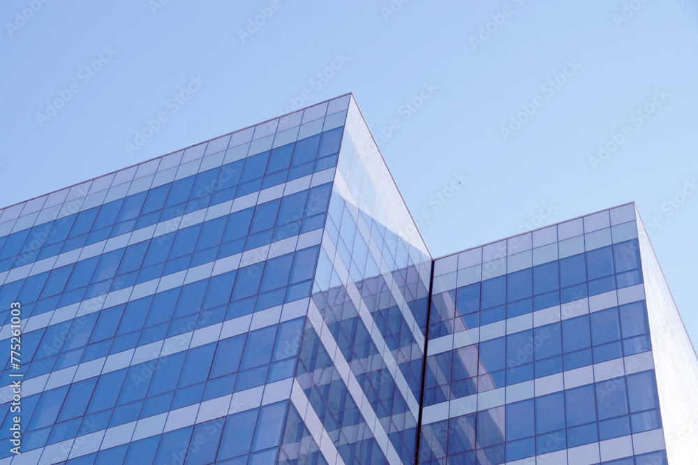 glass facade of a skyscraper in sunlight