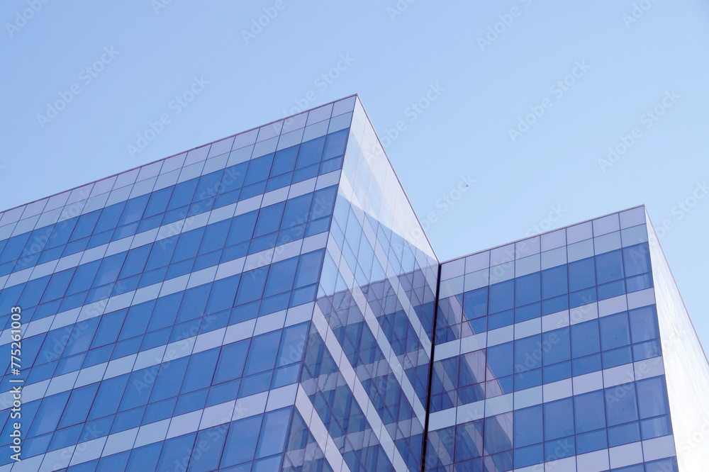 glass facade of a skyscraper in sunlight glass facade of a skyscraper in sunlight