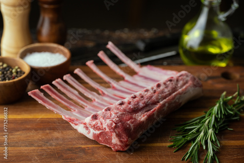 fresh lamb chop on wooden cutting board