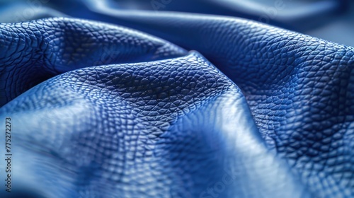 Detailed shot of blue leather material, suitable for backgrounds or textures photo