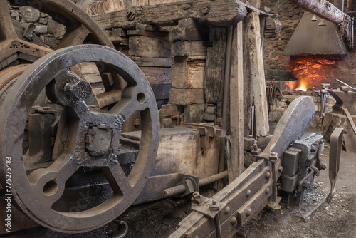 Historic machinery in a blacksmiths worksshop.