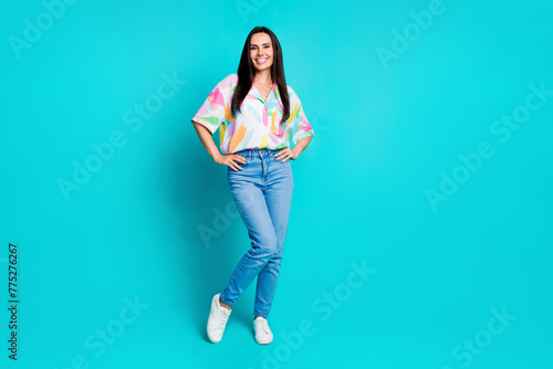 Photo of gorgeous lovely nice cheerful woman wear stylish print outfit isolated on cyan color background