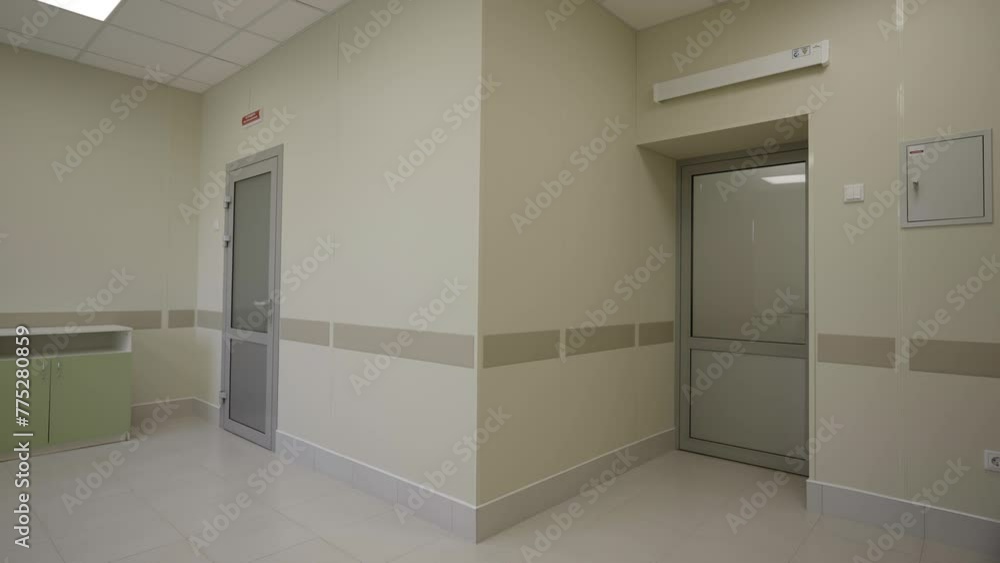 Empty hall of hospital alight by soft morning light. Contemporary ...