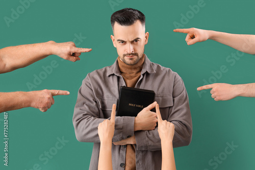 People pointing at young ma...