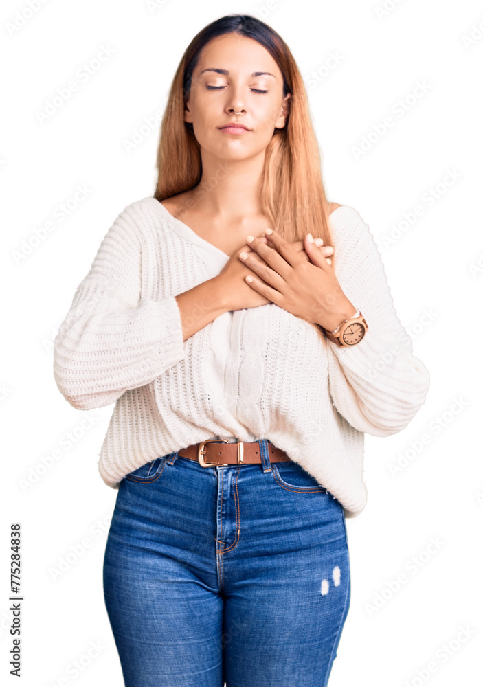 Beautiful young woman wearing casual clothes smiling with hands on chest with closed eyes and grateful gesture on face. health concept. Beautiful young woman wearing casual clothes smiling with hands on chest with closed eyes and grateful gesture on face. health concept.