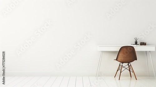 Workspace with minimalistic desk and chair against a pristine white wall