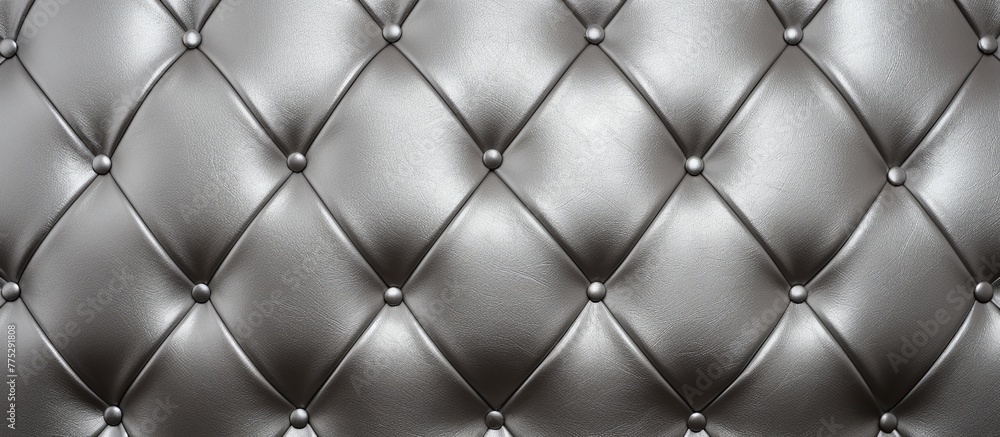 Black leather upholstery with close-up details of intricate button tufting, creating a sophisticated and timeless look Black leather upholstery with close-up details of intricate button tufting, creating a sophisticated and timeless look