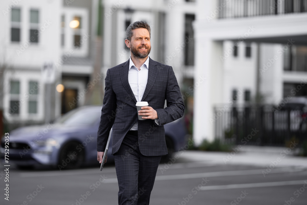 Business man in suit. Businessman walking in city. Hispanic man walk on street. Business man with laptop and coffee walking outdoor. Business man in suit go to office work. Success business. Business man in suit. Businessman walking in city. Hispanic man walk on street. Business man with laptop and coffee walking outdoor. Business man in suit go to office work. Success business.