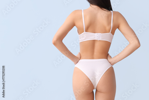 Young woman in white underw...