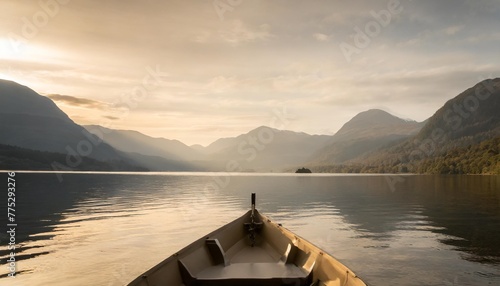 a boat on a lake with mountains in the background scenery © joesph