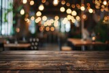 Wooden table in restaurant with background lights. Great for food and drink concepts
