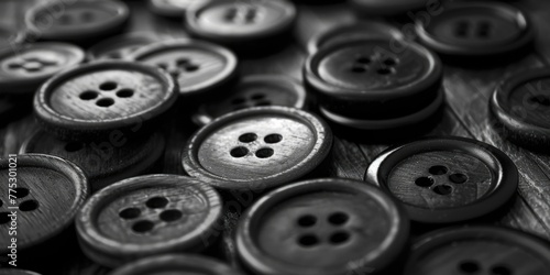 A pile of buttons on a wooden table. Perfect for crafting projects