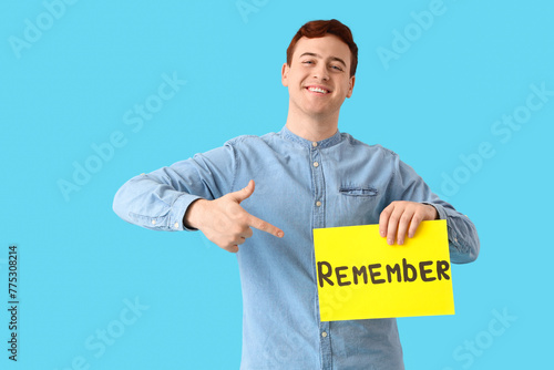 Young man pointing at paper...