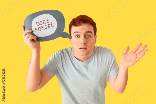 Young man holding speech bu...