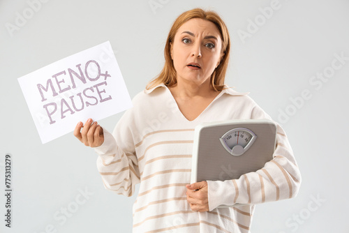 upset mature woman holding ...