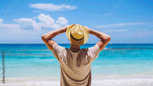 back male person on the beach wearing a summer hat be happy rising his arms in luck © bmf-foto.de