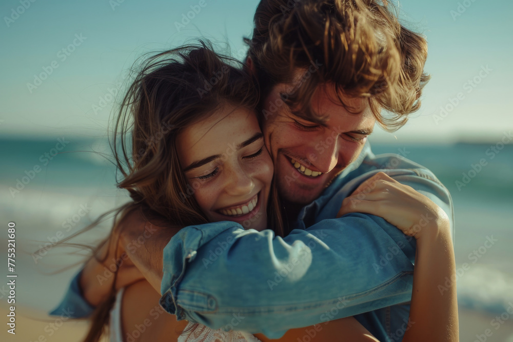 A man and woman are hugging and smiling on the beach A man and woman are hugging and smiling on the beach