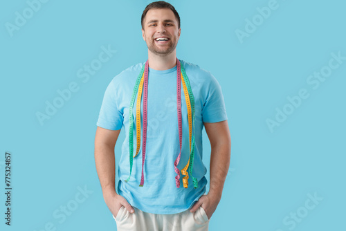 Young man with measuring ta...