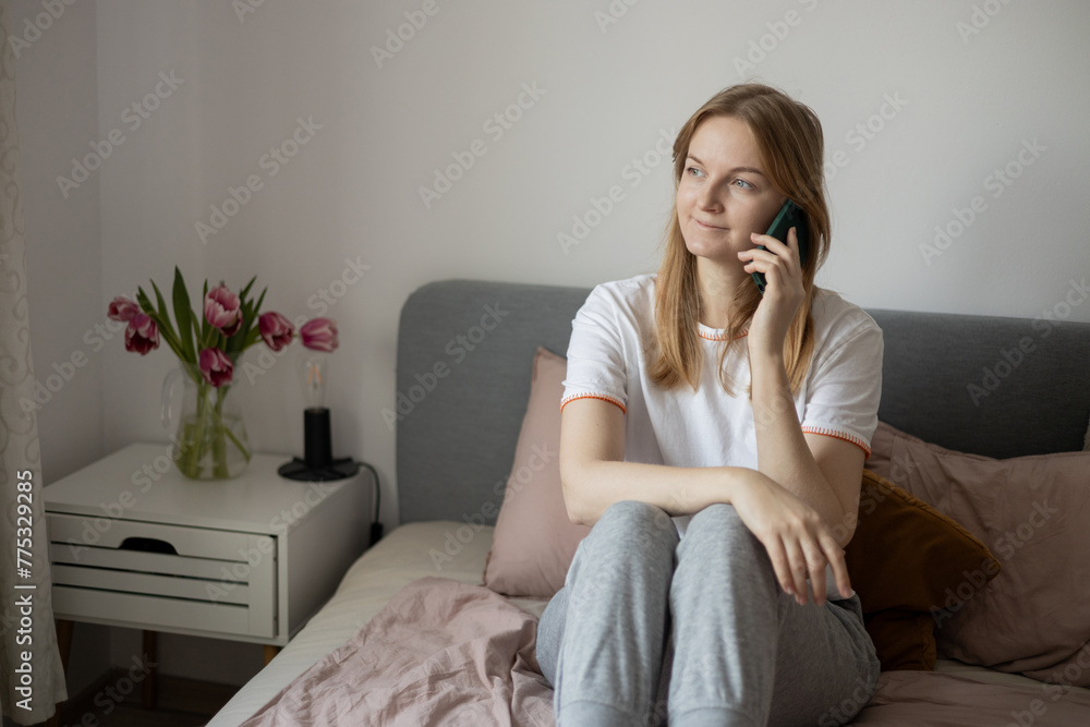 Happy blonde woman talking on the smart phone, technology and communication concept. Speaking, discussion or conversation at home, happy and social media on phone call Happy blonde woman talking on the smart phone, technology and communication concept. Speaking, discussion or conversation at home, happy and social media on phone call