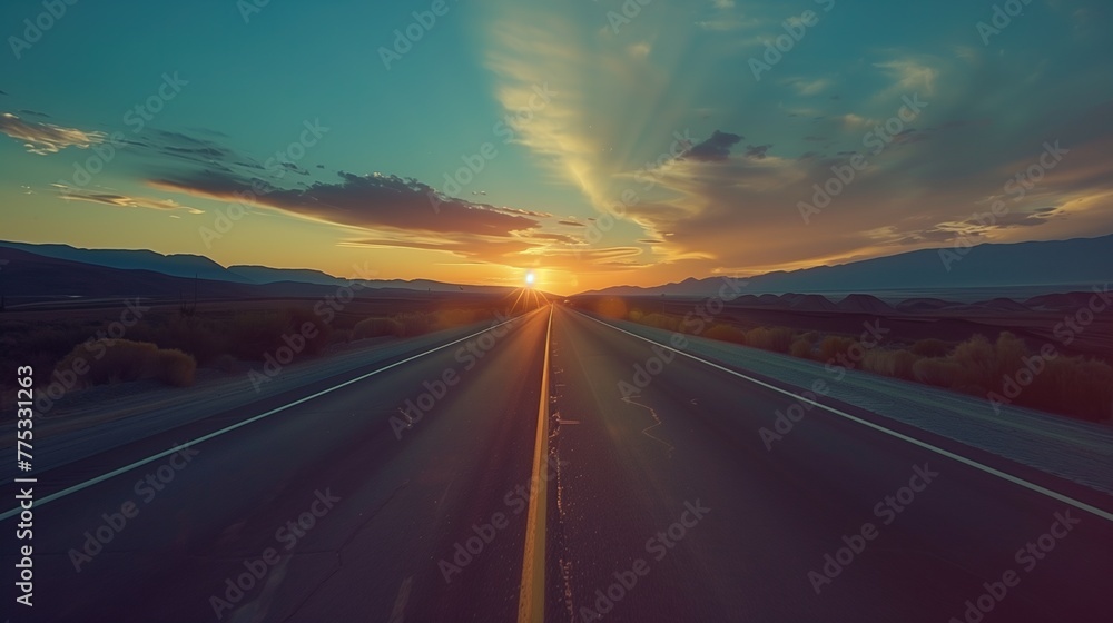 Majestic Sunset Over a Long Stretch of Desert Road