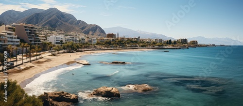 beautiful Albir town with main boulevard promenade, seaside beach and Mediterranean sea photo