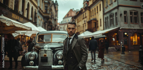 man in a suit against the background of a retro car © Андрей Трубицын