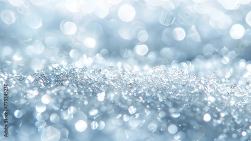 Sparkling light reflecting on a blue bokeh background - Close-up shot of glittering surfaces with a soft blue bokeh effect creating a dreamy atmosphere