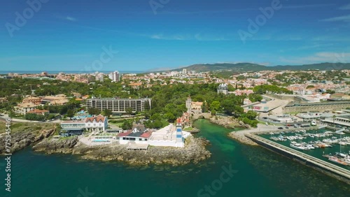 Wallpaper Mural Aerial drone view of Santa Marta light house and Cascais marina with moored yacht boats with Cascais cityscape, Portugal. Orbit parallax shot Torontodigital.ca