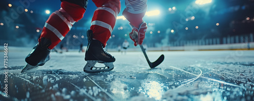 Ice hockey player in action on a rink at night